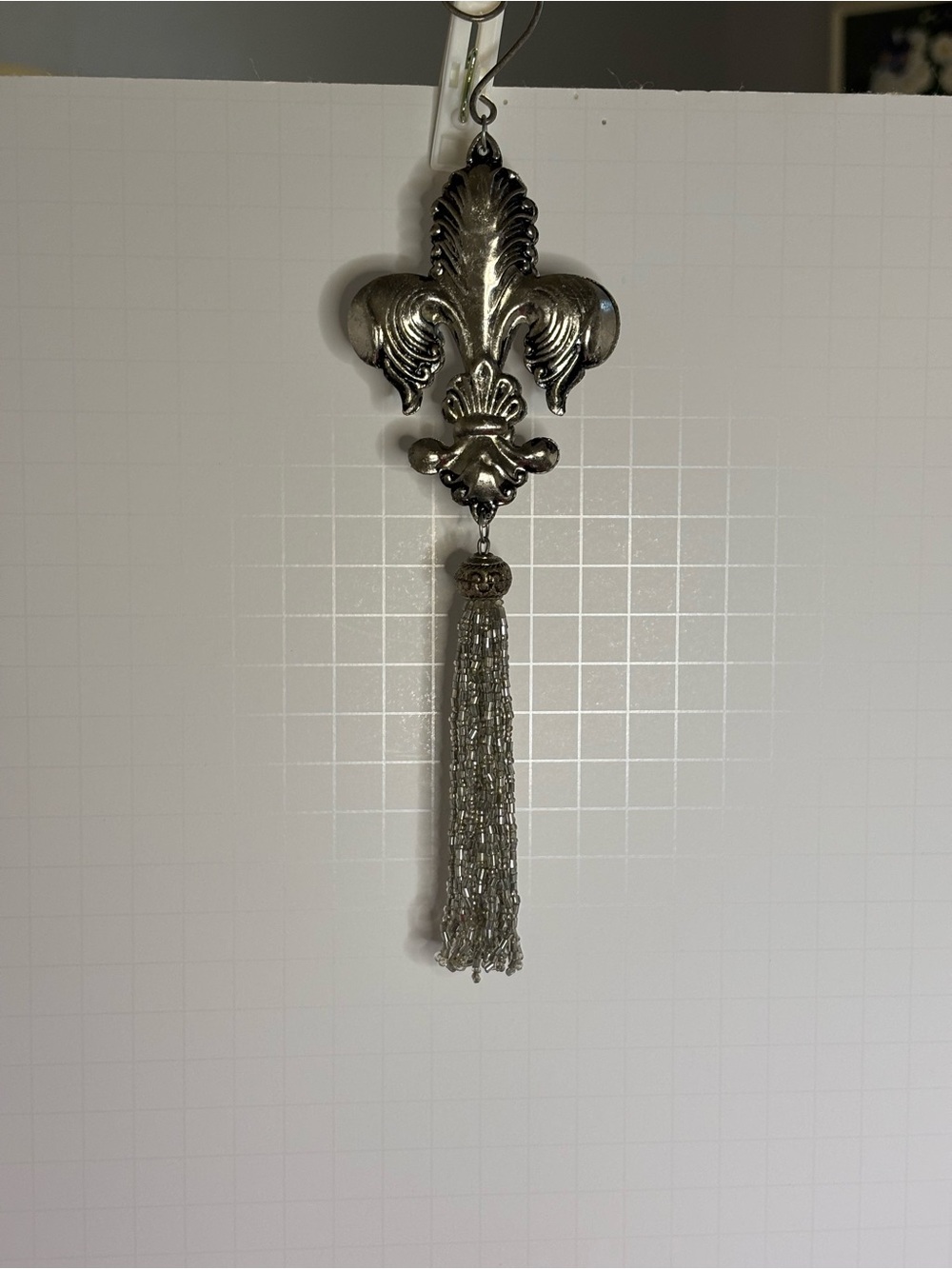 Metal Fleur-de-Lis Hanging Ornament with Silver tone Tassel